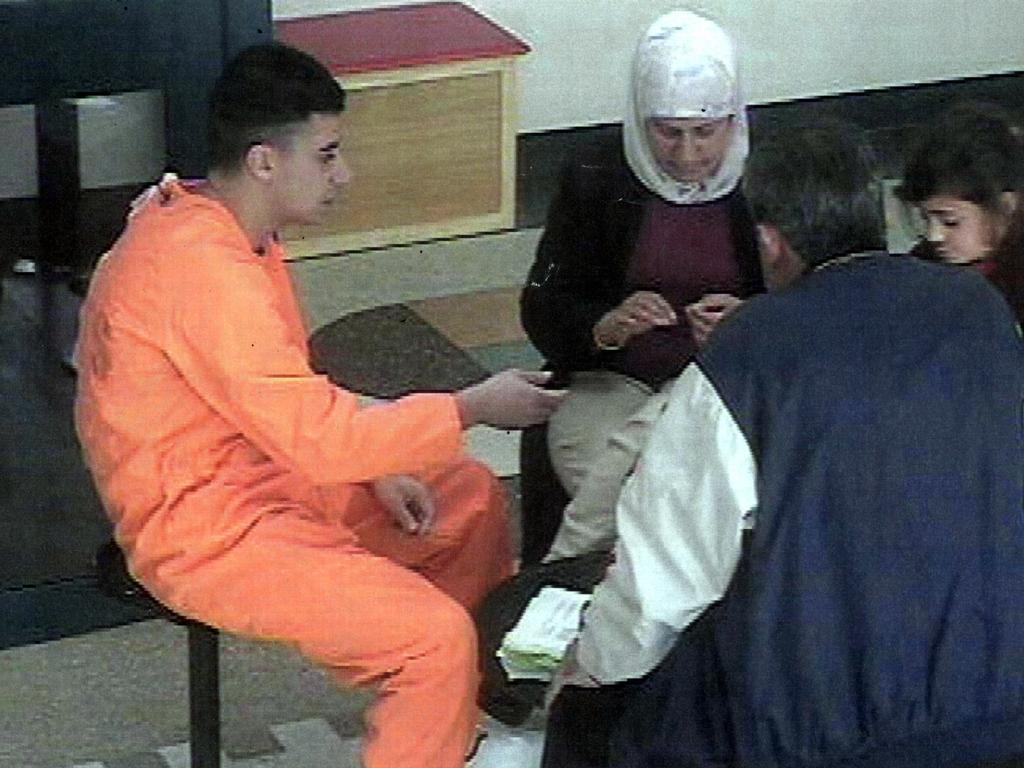 Security video still of Mohammed’s older brother Bilal passing papers to his mother Baria during her visit to Supermax at Goulburn Jail. Picture: NSW Department of Corrective Services