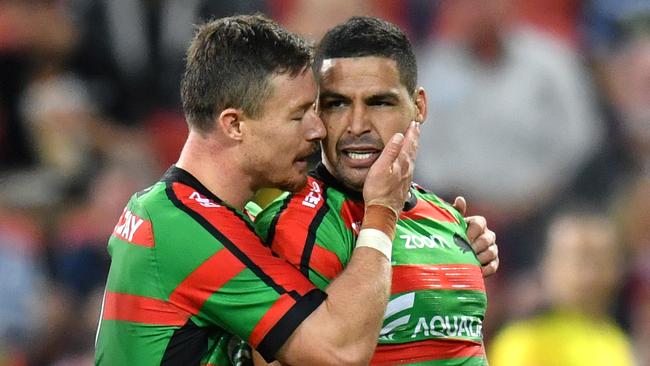 Cody Walker is congratulated by Rabbitohs teammate Damien Cook after scoring a try. Picture: AAP