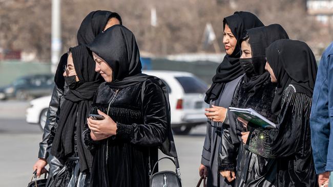 Afghan female students enrolled in health studies walk along a street in Kabul on Tuesday. Picture: AFP