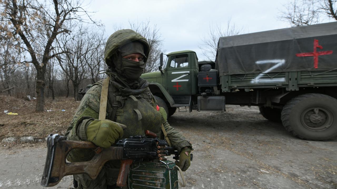 Pro-Russian separatists, in uniforms without insignia, gather in the separatist-controlled settlement of Mykolaivka (Nikolaevka) and Bugas, in Donetsk region (DPR) of Ukraine on March 01, 2022. (Photo by Stringer/Anadolu Agency via Getty Images)