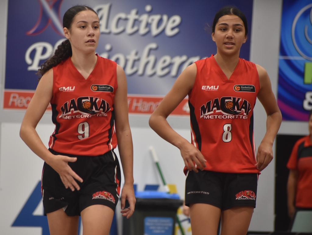 (From left) Cheyenne Bobognie and Isabel Smith for the Mackay Meteorettes in the U14 State Championship final against Cairns Dolphins in Mackay, July 10, 2021. Picture: Matthew Forrest