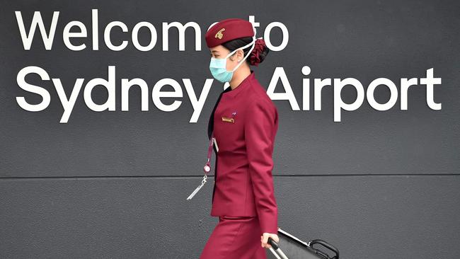 A Qatar Airways crew member enters Sydney international airport in April. Picture: Peter Parks / AFP