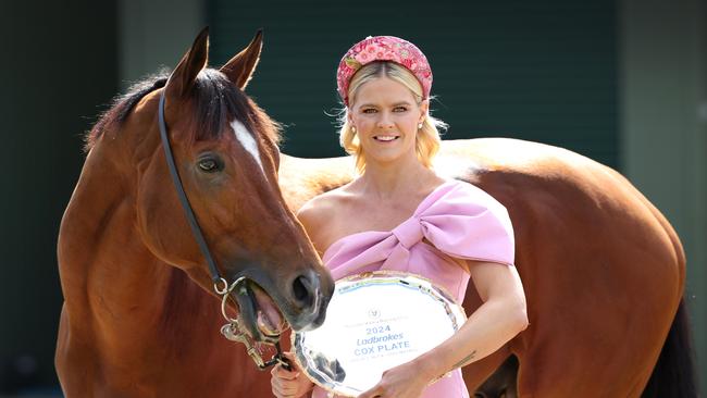 Olympic swimmer Shayna Jack cuddles up with Cox Plate fancy Docklands tasting the Cox Plate at Werribee Racecourse Quarantine Centre.                      Picture: David Caird