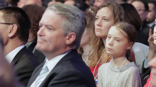 Mathias Cormann listens to Donald Trump’s opening address, as Greta Thunberg listens behind him. Picture: AFP.