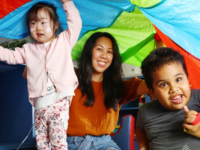 Early Years Special Education teacher Diana Backhouse with Shion 4, and Harrison 5 at Nursery Road State Special School at Holland Park. Picture Lachie Millard