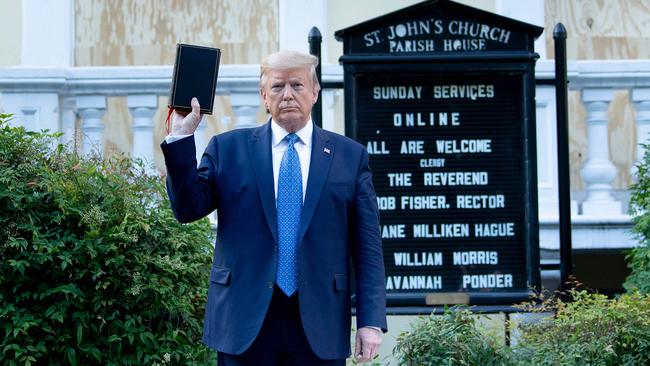 Donald Trump holds a Bible outside St John's Church across from the White House. Picture: AFP