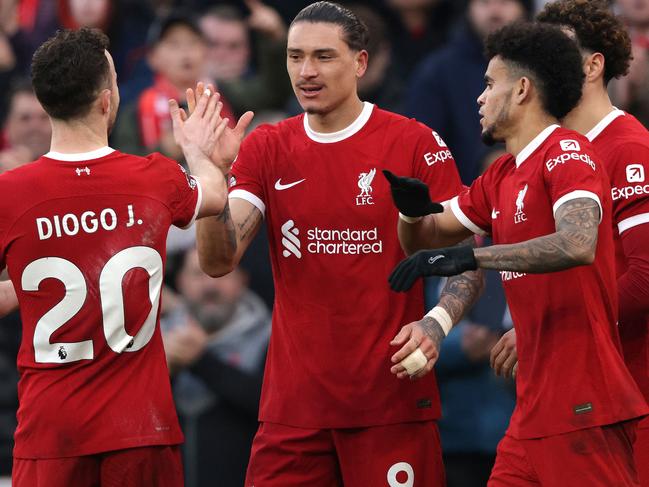 Liverpool's Uruguayan striker #09 Darwin Nunez (2L) celebrates scoring the team's third goal with Liverpool's Portuguese striker #20 Diogo Jota (L) during the English Premier League football match between Liverpool and Burnley at Anfield in Liverpool, north west England on February 10, 2024. (Photo by Ian Hodgson / AFP) / RESTRICTED TO EDITORIAL USE. No use with unauthorized audio, video, data, fixture lists, club/league logos or 'live' services. Online in-match use limited to 120 images. An additional 40 images may be used in extra time. No video emulation. Social media in-match use limited to 120 images. An additional 40 images may be used in extra time. No use in betting publications, games or single club/league/player publications. /