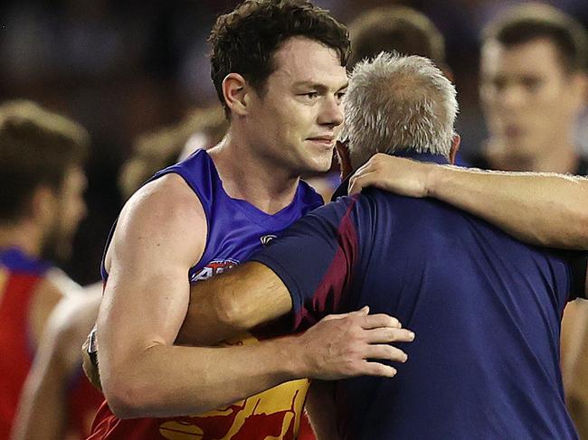 AFL Round 3.   01/04/2021.  Collingwood vs Brisbane Lions at Marvel Stadium, Melbourne.   Chris Fagan, senior coach of Brisbane  hugs Daniel Rich and Lachie Neale after Zac Bailey  kicked a goal after the siren to give the Lions a 1 point win  . Pic: Michael Klein