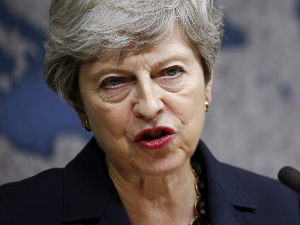 Britain's Prime Minister Theresa May speaks at Chatham House in London, Wednesday July 17, 2019. Prime Minister Theresa May says she worries about the increasing "absolutism" of world politics, in a message many will see as aimed at her successor as Britain's leader and President Donald Trump. (Henry Nicholls/Pool via AP)