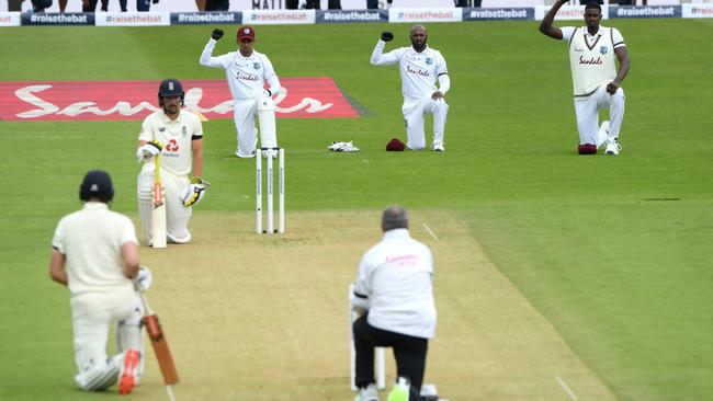 England’s Rory Burns and Dom Sibley take a knee with Shane Dowrich, Jermaine Blackwood and Jason Holder of the West Indies in Southampton. Picture: Getty