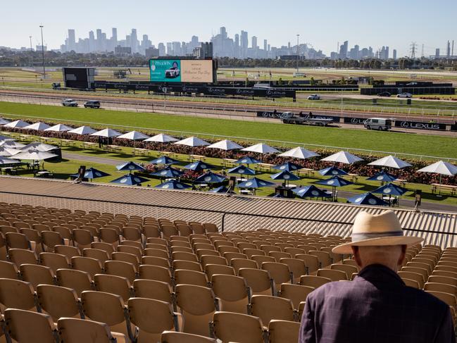 An early punter takes up a seat at Flemington Racecourse. Picture: Diego Fedele/Getty Images