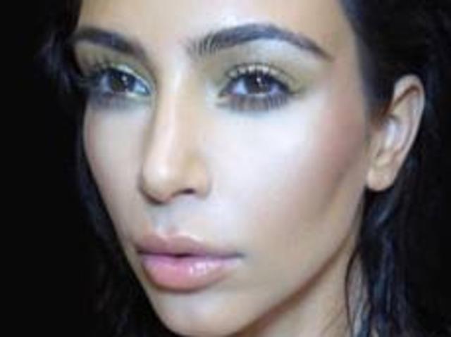 Wowsers: Kim flaunts cleavage on book cover