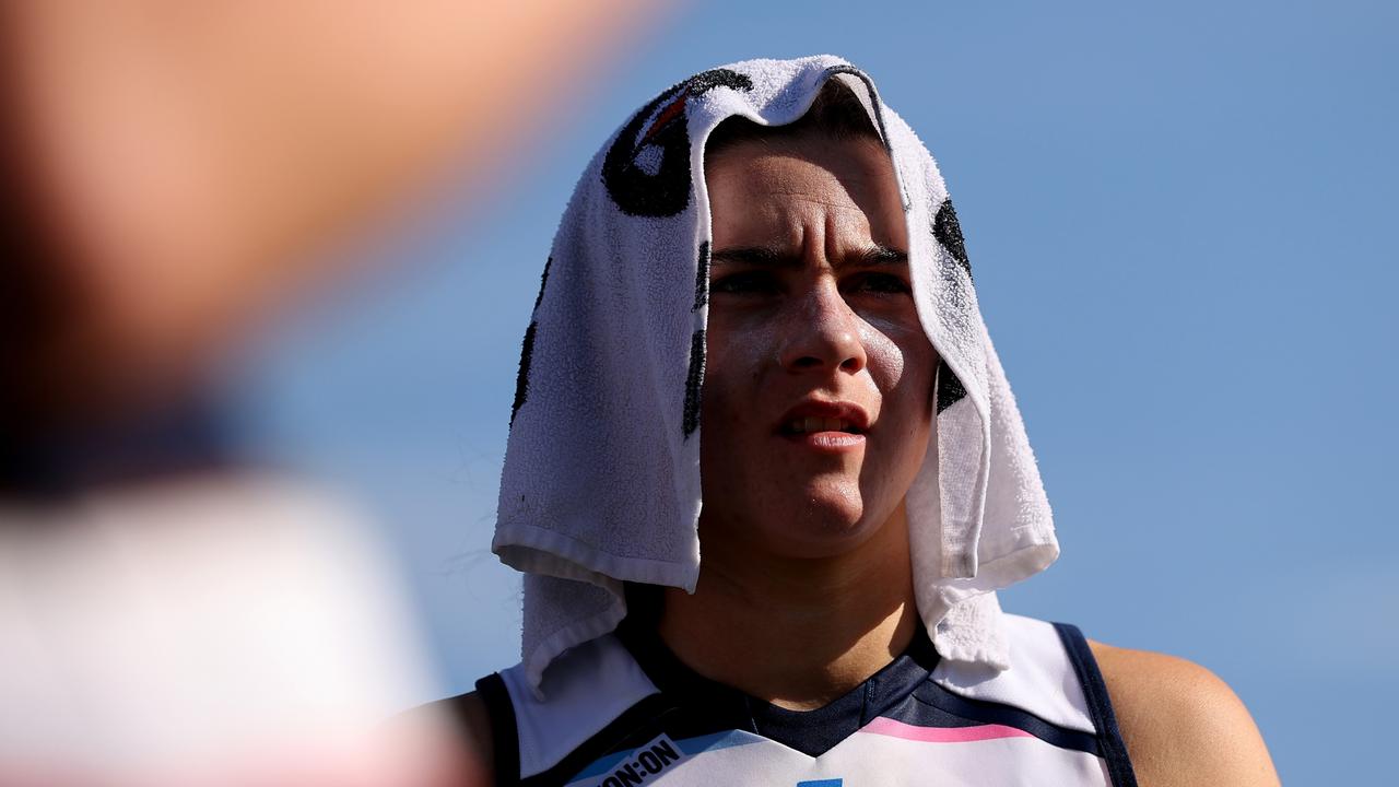 Darcy Moloney shades herself from the Sydney sun at three quarter-time. Brendon Thorne/AFL Photos/via Getty Images)