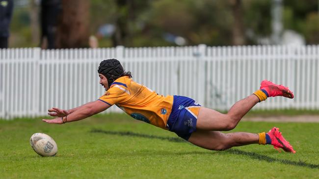 Keanu Wright-Dunrobin attempts the put down but the ball beats him over the dead-ball line. Picture: Adam Wrightson Photography