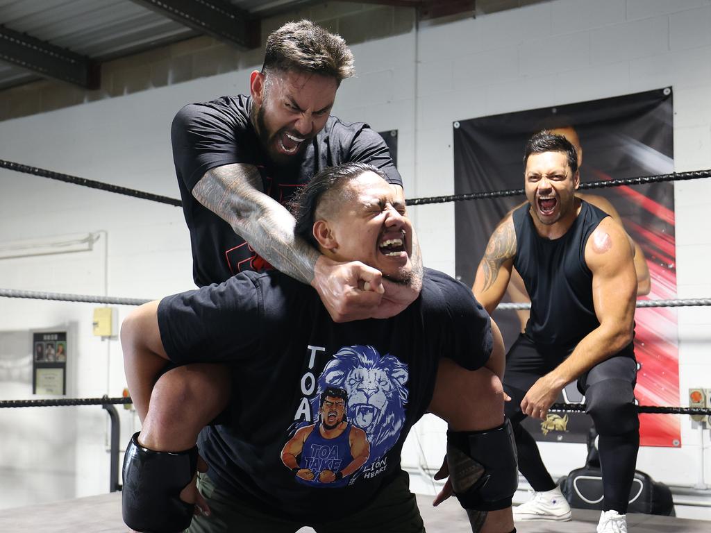 Former Broncos Stars Daniel Vidot and Alex Glenn wrestling at Underwood with wrestler Toa (Pj Ieremia). Picture: Annette Dew.