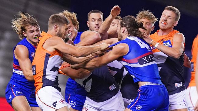 Marcus Bontempelli of the Bulldogs and players wrestle at the end of the third quarter during the Round 3 AFL match between Western Bulldogs and GWS Giants at Marvel Stadium in Melbourne, Friday, June 19, 2020. (AAP Image/Scott Barbour) NO ARCHIVING, EDITORIAL USE ONLY