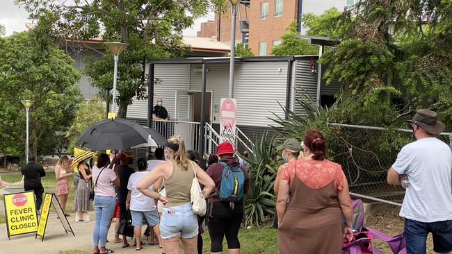 People at the front of Ipswich Hospital Fever Clinic's testing line were they had been waiting for nearly six hours. Picture: Jessica Baker