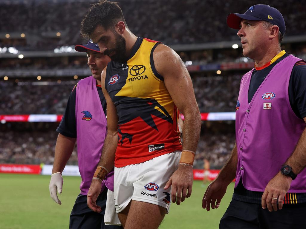 Wayne Milera is helped from the field after being injured against Fremantle. Picture: Will Russell/AFL Photos via Getty Images