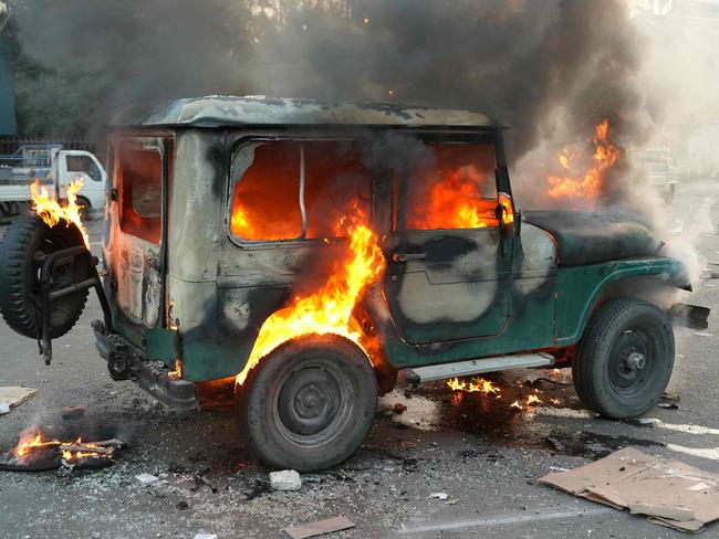 A vehicle burns after anti government forces ransacked government security facilities, in Damascus, on December 8, 2024. Islamist-led rebels declared on December 8, that they have taken the Syrian capital in a lightning offensive, sending President Bashar al-Assad fleeing and ending five decades of Baath rule in Syria. (Photo by Rami al SAYED / AFP)