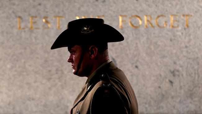 A soldier stands next to the Cenotaph during the Sydney Dawn Service.