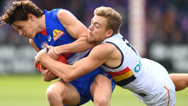 Hugh Greenwood tackles Western Bulldog Patrick Lipinski in his final game for the Crows in round 23. Picture: Getty Images