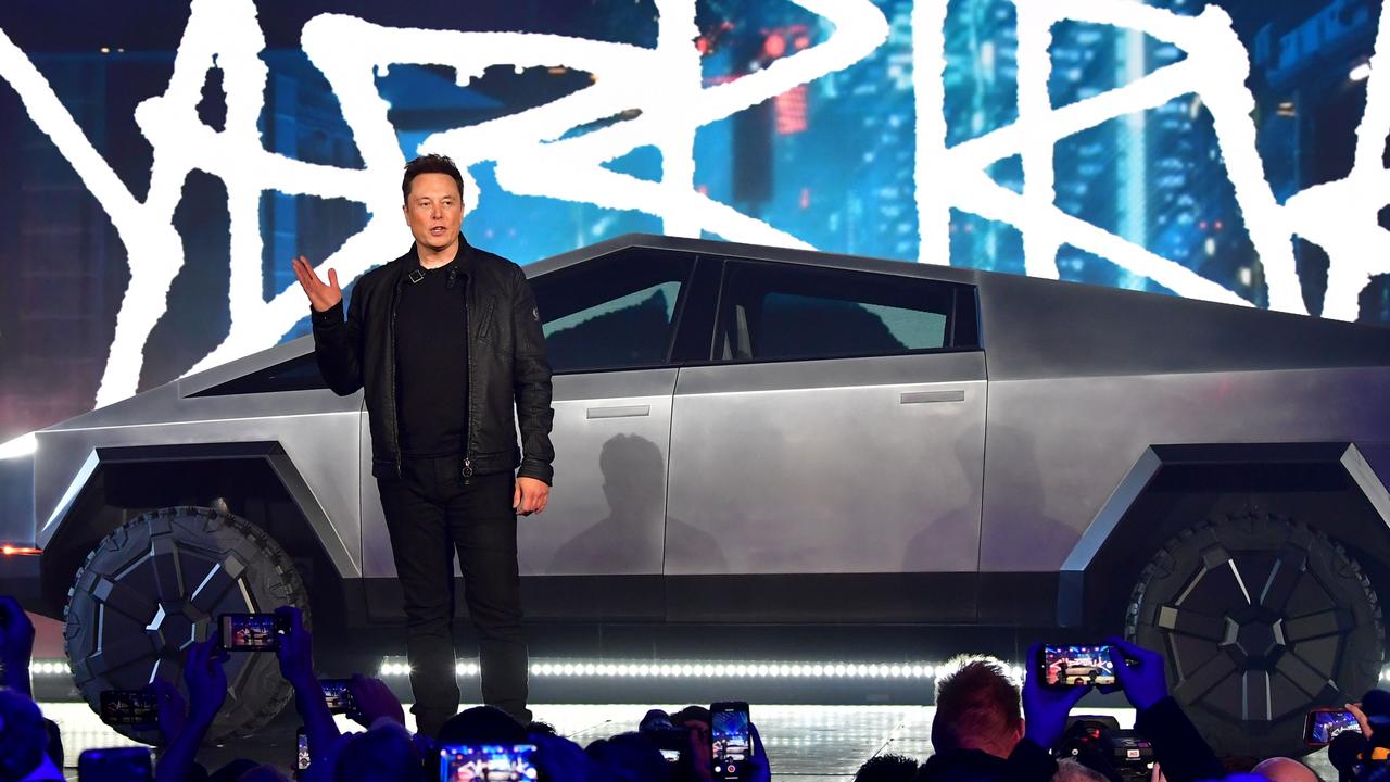 Elon Musk revealing the Tesla Cybertruck in 2019. (Photo by Frederic J. BROWN / AFP)