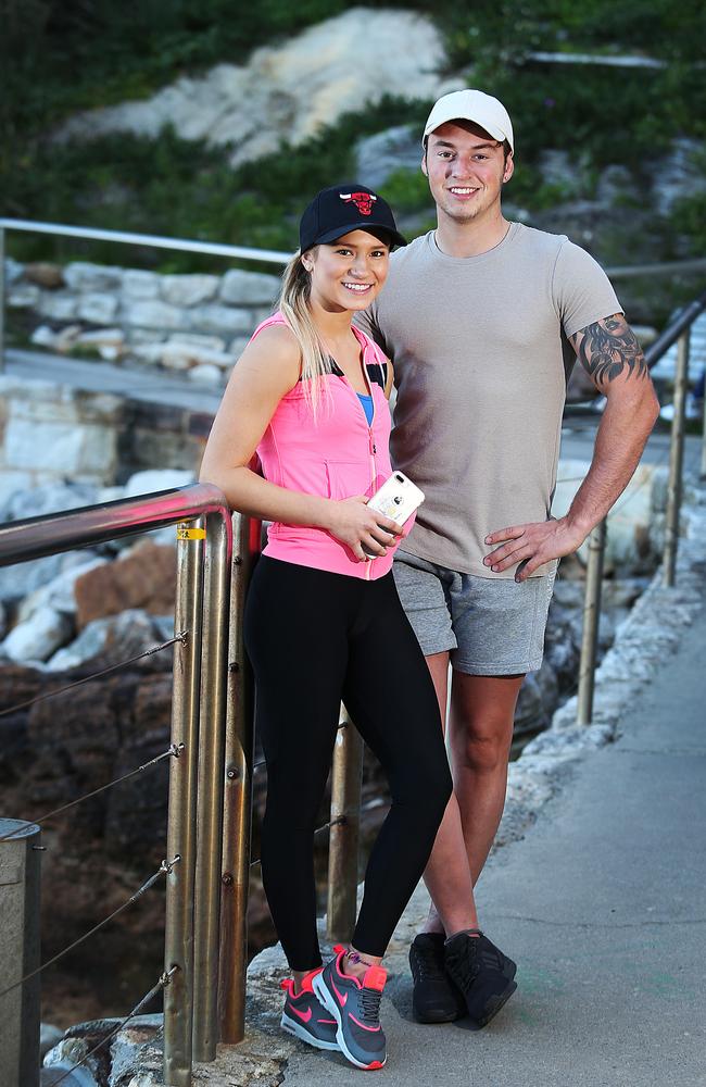 Stef Miko and Jacob Barnfield hit the Bondi Coastal Walk to rack up their steps, with Stef using a mobile phone app to keep count.