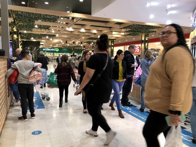 Shoppers at Stockland Wetherill Park Shopping Centre where at least five people with coronavirus have reported spending time at the mall while infectious.