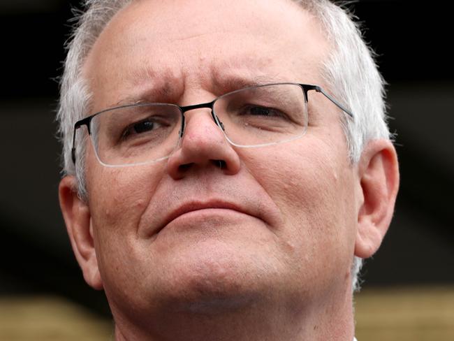 SYDNEY, AUSTRALIA - NewsWire Photos DECEMBER 8, 2021: Prime MinisterScott Morrison pictured at a press conference at Penshurst Girls High School. Prime Minister Scott Morrison and Erin Molan visit  Penshurst Girls High School with Assistant Minister to the Prime Minister for Mental Health and Suicide Prevention David Coleman to meet with students and discuss social media trolling.Picture: NCA NewsWire / Damian Shaw