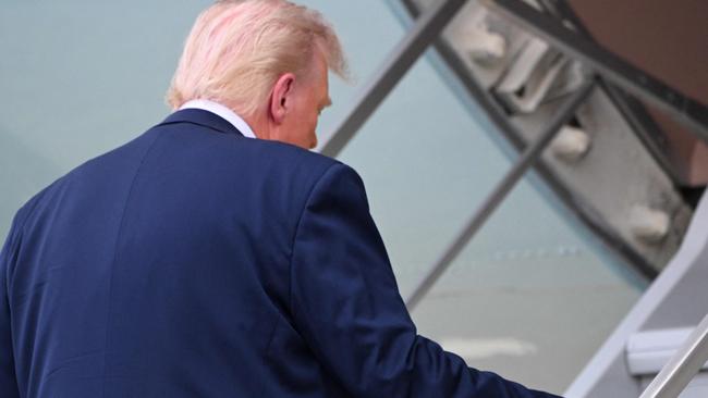 Mr Trump boarding Air Force One. Picture: Roberto Schmidt/AFP