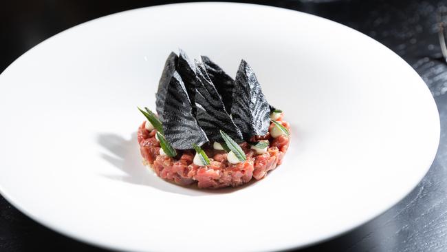 Aged beef tartare with artichoke and marigold. Picture: Jason Edwards