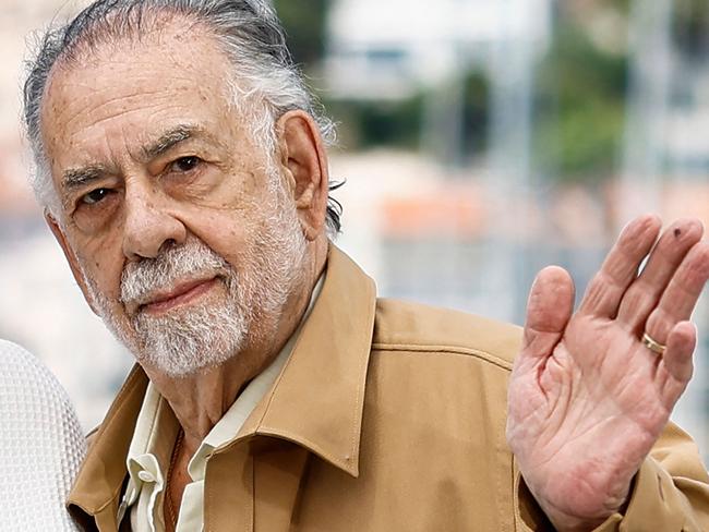 (FILES) US director Francis Ford Coppola waves during a photocall for the film "Megalopolis" at the 77th edition of the Cannes Film Festival in Cannes, southern France, on May 17, 2024. Filmmaker Francis Ford Coppola and rockers the Grateful Dead are among this year's Kennedy Center Honors inductees, along with beloved blues singer Bonnie Raitt and jazz artist Arturo Sandoval. The Apollo -- the globally celebrated Harlem music venue that launched careers and bore witness to sociocultural revolution -- will receive a special honor as an iconic US institution, organizers announced on July 18, 2024. The annual Kennedy Center Honors, among the highest American arts honors, see Washington's political elite rub shoulders with the cream of the cultural crop as entertainment A-listers descend on the US political center. (Photo by Sameer Al-Doumy / AFP)