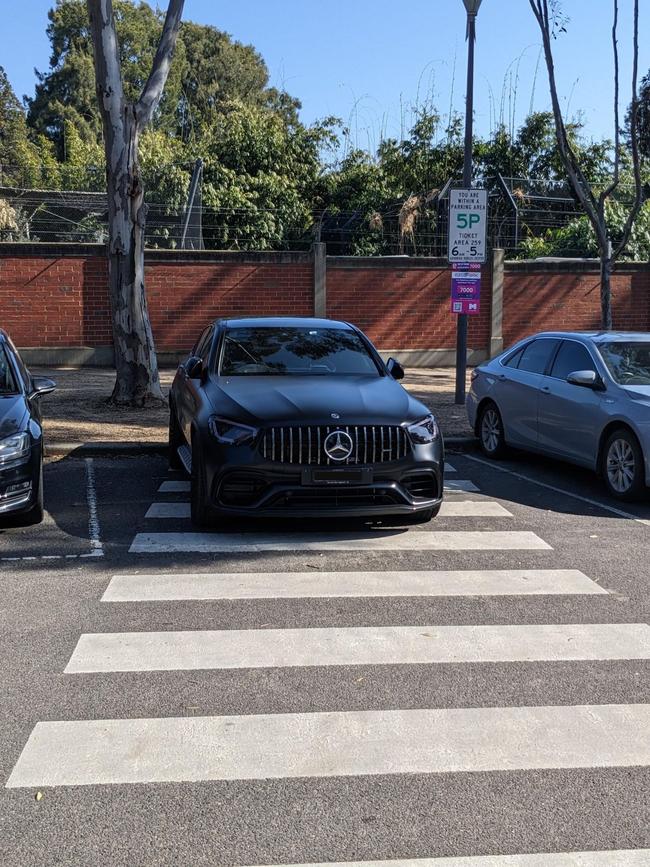 A Mercedes parked over a pedestrian crossing has angered hundreds online. Picture: Reddit