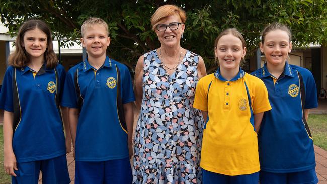 Parap Primary School students Thembi Hawke, Thomas Jelly, and Ruby and Isabelle Atkinson helped principal Yvonne Harding celebrate her final day at the school after almost 26 years. Picture: Pema Tamang Pakhrin