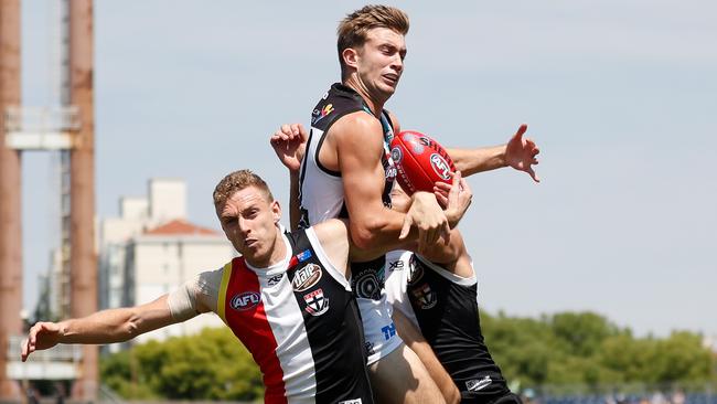 Dougal Howard of the Power marks over Callum Wilkie. Picture: Michael Willson/AFL Photos