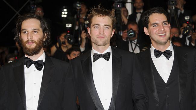 Robert Pattinson with Good Time director Benny Safdie (left), and director Josh Safdie. Picture: AP Photo/James McCauley