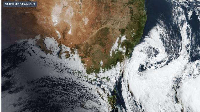 A low pressure system spinning over the Tasman Sea on Monday brought a wintry mix of rain, snow, hail, blustery winds and large waves in parts of southeastern Australia.