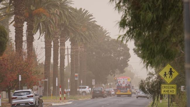 Motorists navigate the dusty conditions. Picture: Michael DiFabrizio