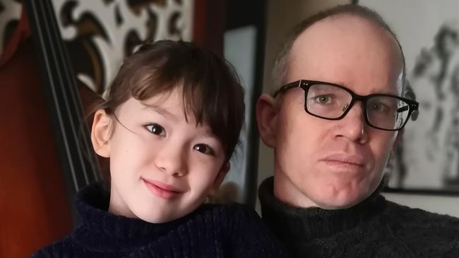 Australian Simon Carter and daughter Imogen in their flat in Wuhan, China. Picture: Supplied