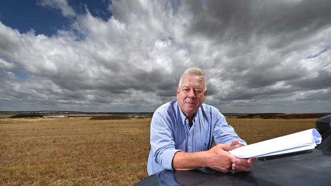 A frustrated John Wagner, holding site plans, on the area at his Wellcamp Airport where he wants to immediately build a COVID quarantine facility. Picture: Lyndon Mechielsen/The Australian