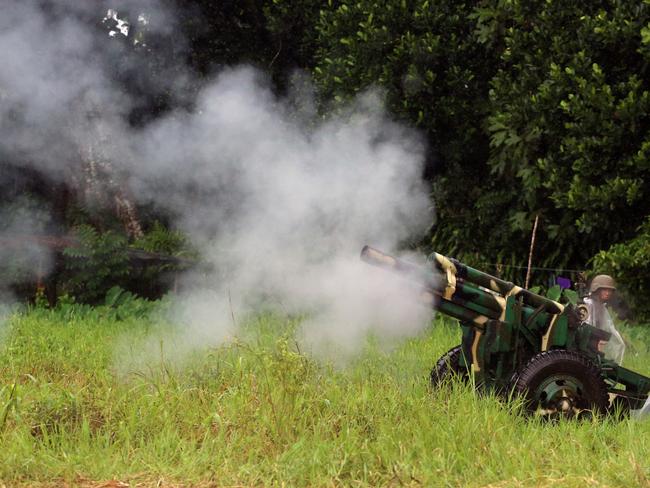 Soldiers from the 1st Field Artillery Battalion fire 105mm Howitzer shells into the township of Marawi in an attempt to kill the militants who are still in the town. Picture: Gary Ramage