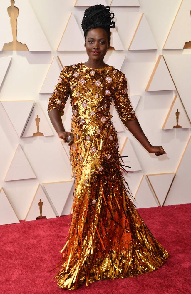 Golden girl Lupita Nyong'o in Prada. Picture: AFP