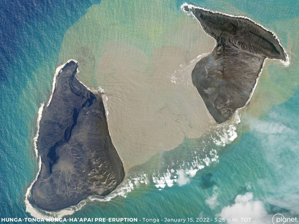 An aerial image shows the centre of the volcanic island vanish, splitting it in two.