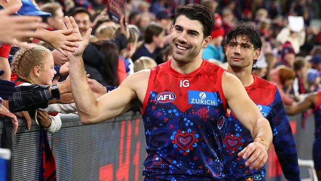 MELBOURNE, AUSTRALIA - MAY 26: Christian Petracca of the Demons high fives fans after winning the round 11 AFL match between Narrm (the Melbourne Demons) v Euro-Yroke (the St Kilda Saints) at Melbourne Cricket Ground, on May 26, 2024, in Melbourne, Australia. (Photo by Quinn Rooney/Getty Images)