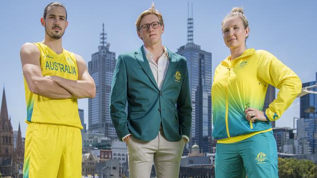 Chris Goulding, Mack Horton and Melissa Tapper unveiling the Australian uniforms. Picture: Jason Edwards