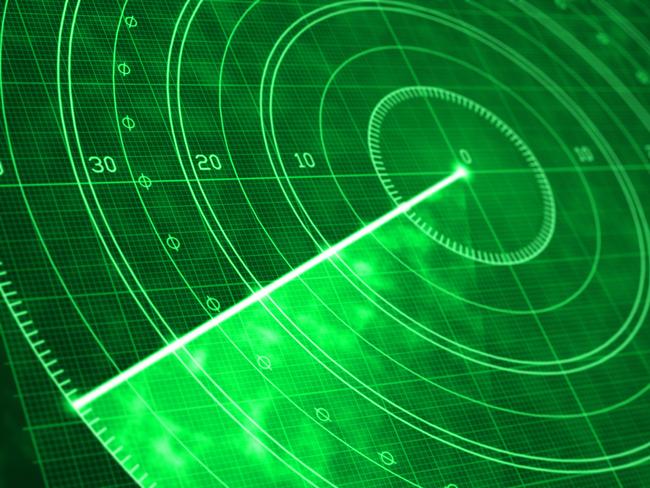 Detail of a green military radar screen with glowing coordinates and positioning numbers. Scanner axis is visible while spinning around the center. Field is empty and no objects are detected. Diminishing perspective and selective focus.