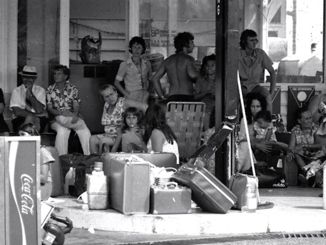 Cyclone Tracy caused major destruction to Darwin. Desperate survivors wait with their possessions at the BP station in Fannie Bay in Darwin in the aftermath of Cyclone Tracy, which devastated the town in 1974. The survivors were mostly waiting to be airlifted out. Picture Beat Erismann.