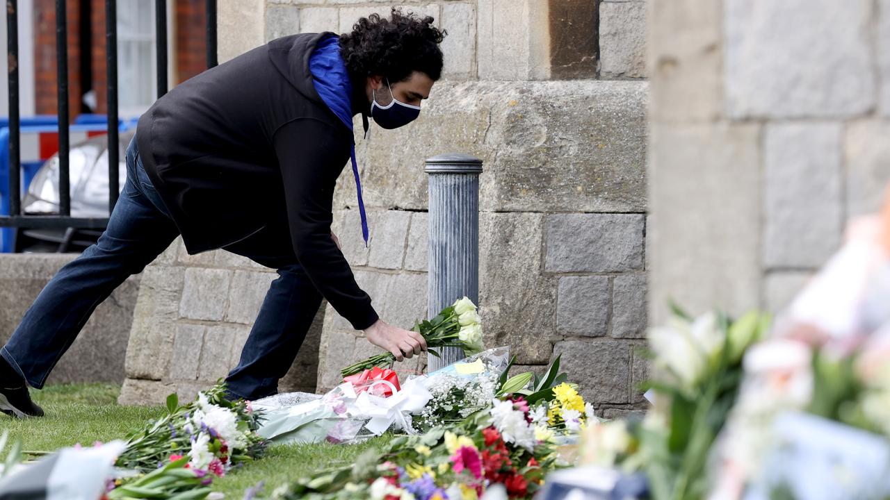 Members of the public lay floral tributes outside of Windsor Castle after Prince Philip’s death. Picture: Chris Jackson/Getty Images