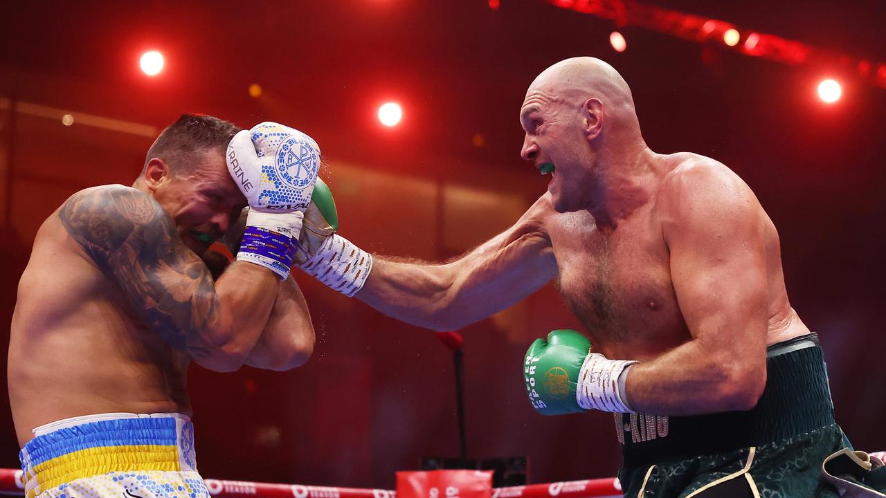 Tyson Fury punches Oleksandr Usyk. Photo by Richard Pelham/Getty Images.