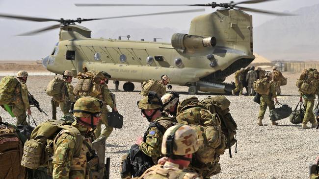 Australian soldiers from the 2nd Mentoring Task Force board a Chinook helicopter to fly out to their new patrol base homes, spread throughout the Uruzgan Province of southern Afghanistan.